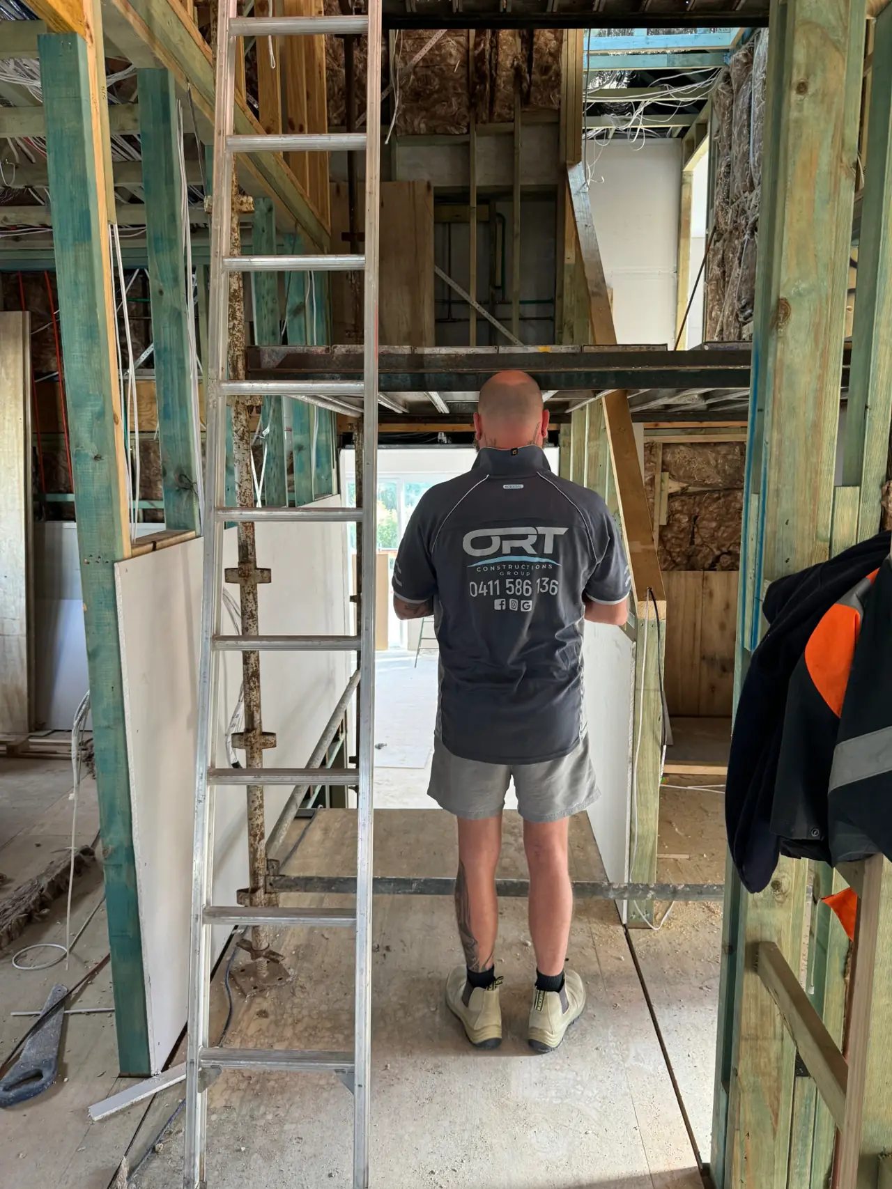 ORT Constructions team member inside a timber-framed renovation