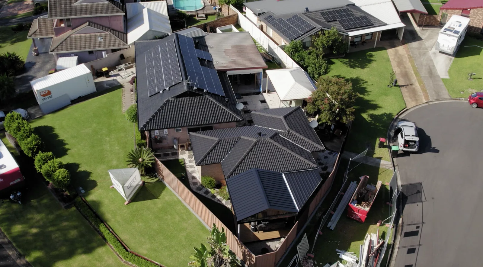 Aerial view of Sydney suburban rooftops and backyards