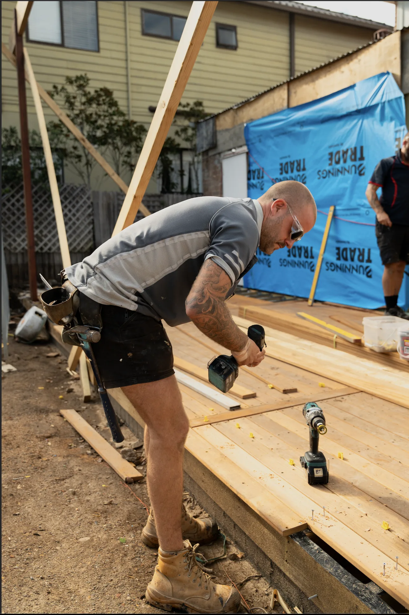 ORT Constructions carpenter fixing hardwood decking boards down to the frame