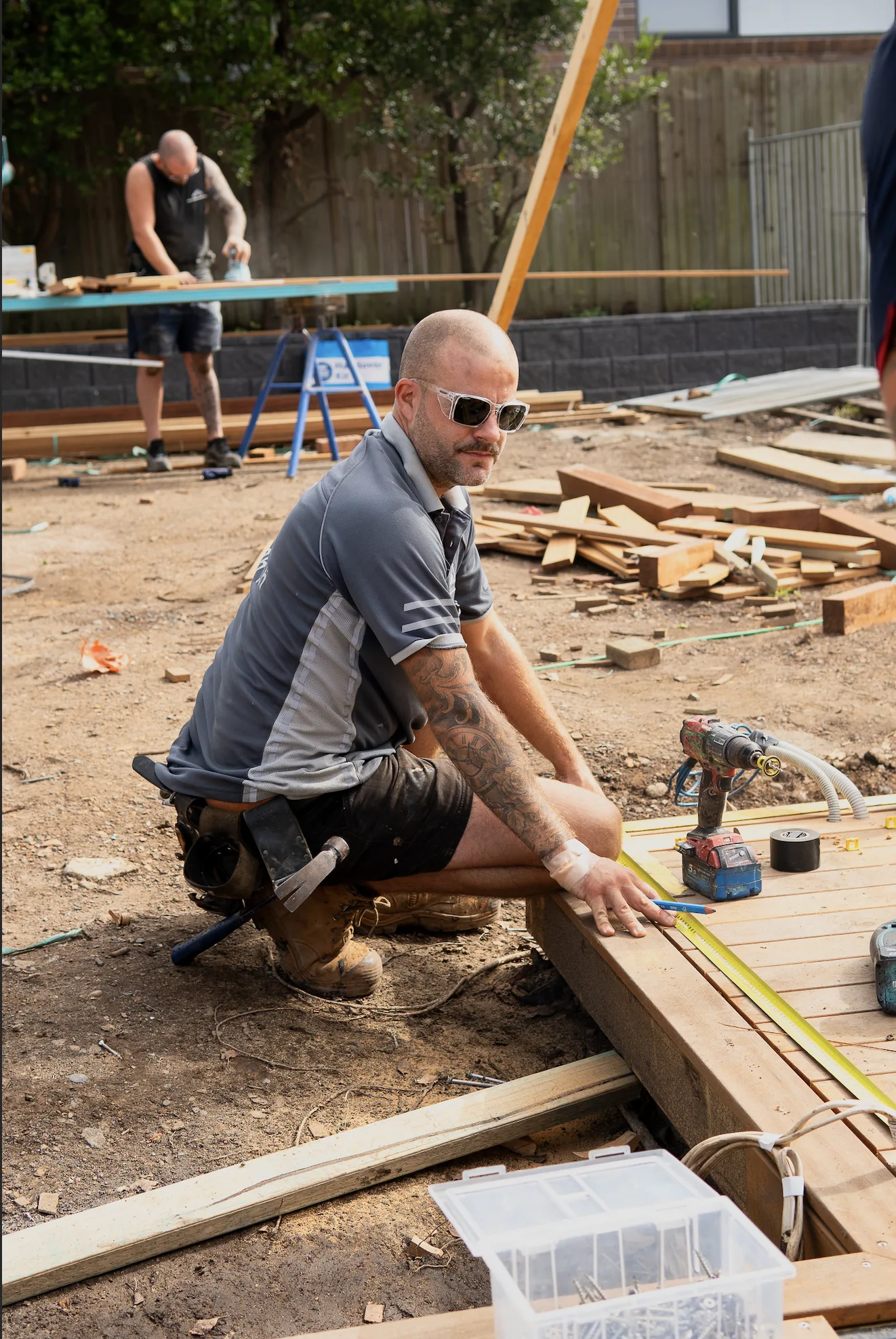 Carpenter measuring and marking timber on a Sydney work site