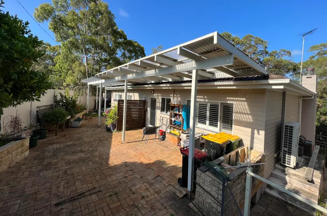 New patio roof frame installed at the rear of the home