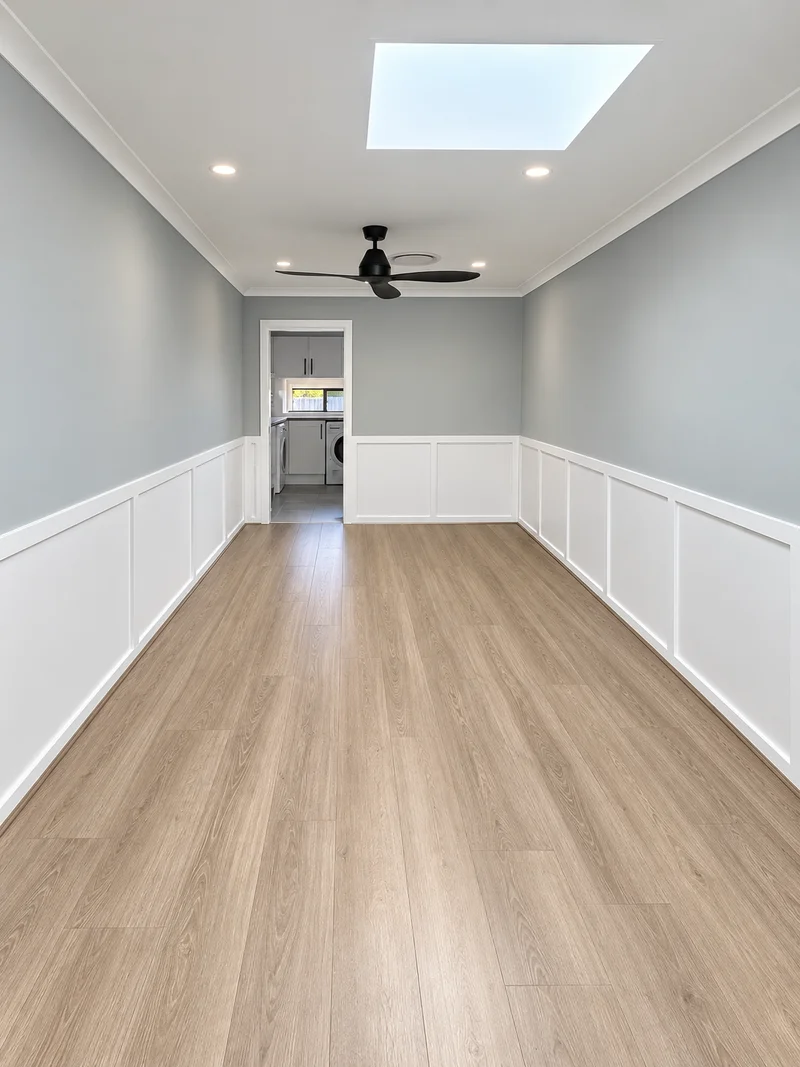 Renovated dining space at Werrington County with skylight, wall panelling and laundry beyond